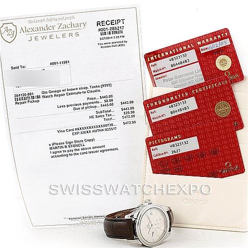 The image shows an Omega De Ville 4832.31.32 Men's Stainless Steel Silver Dial 4832.31.32 Men's Stainless Steel Silver Dial watch at an angle displaying its face and strap, along with the receipt and warranty cards.
