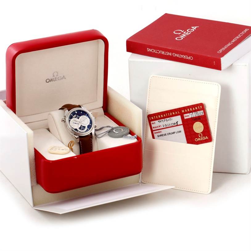 The image shows an Omega De Ville 4847.50.31 Men's Stainless Steel Black Dial 4847.50.31 Men's Stainless Steel Black Dial watch at an angle that highlights the front dial, inside an open red box with warranty and accessories.