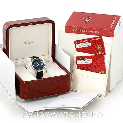 The image shows an Omega De Ville 431.33.41.21.03.001 Men's Stainless Steel Blue Dial 431.33.41.21.03.001 Men's Stainless Steel Blue Dial watch at a front angle, displayed with its box, instruction manuals, and certificates.