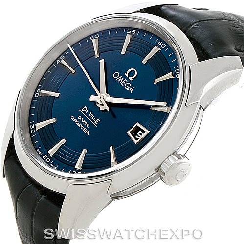 The image shows a side angle of the Omega De Ville 431.33.41.21.03.001 Men's Stainless Steel Blue Dial 431.33.41.21.03.001 Men's Stainless Steel Blue Dial watch, highlighting the blue dial, bezel, crown, and black leather strap.