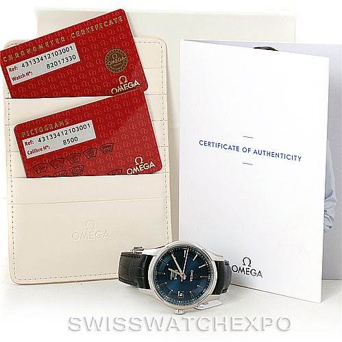 The image shows an Omega De Ville 431.33.41.21.03.001 Men's Stainless Steel Blue Dial 431.33.41.21.03.001 Men's Stainless Steel Blue Dial watch displayed with its authenticity cards, warranty card holder, and a certificate of authenticity.