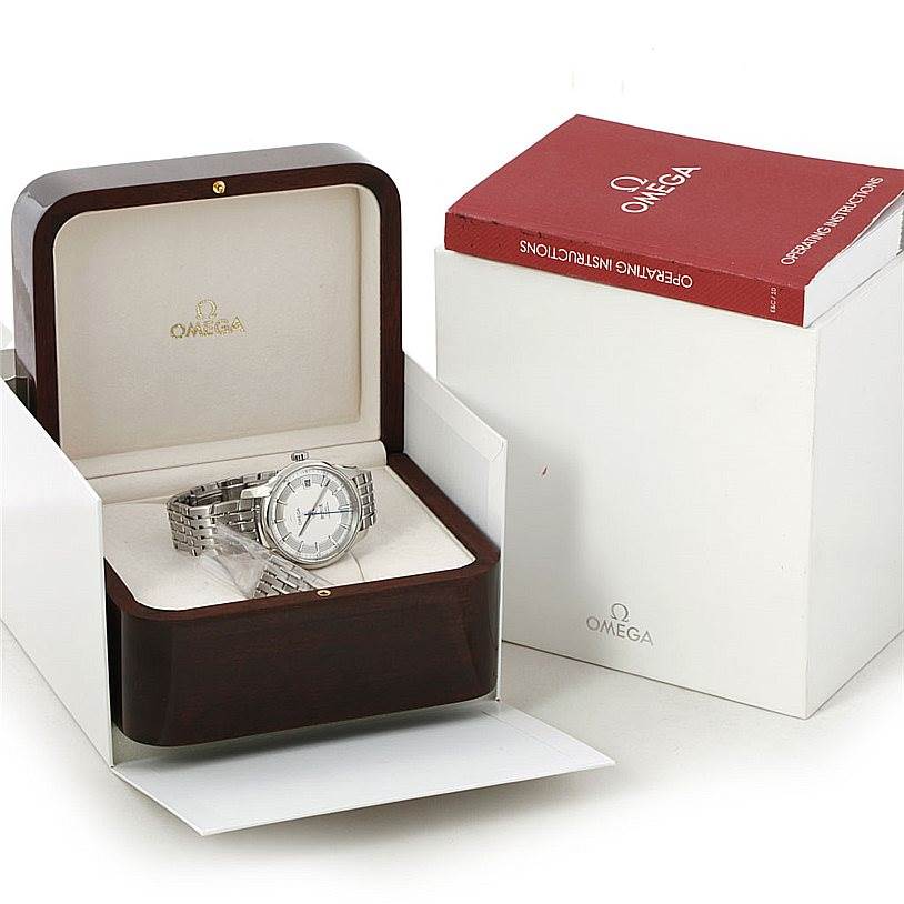 The Omega De Ville 431.30.41.22.02.001 Men's Stainless Steel Silver Dial 431.30.41.22.02.001 Men's Stainless Steel Silver Dial watch is shown inside an open wooden box, with operation instructions beside it.