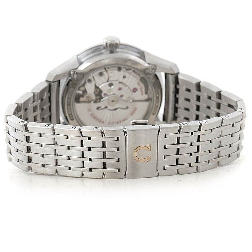 The image shows the stainless steel bracelet and the rear view of the movement of the Omega De Ville 431.30.41.22.02.001 Men's Stainless Steel Silver Dial 431.30.41.22.02.001 Men's Stainless Steel Silver Dial watch.