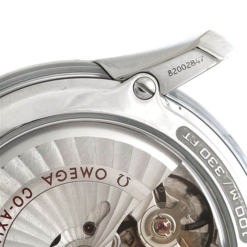 The image shows a close-up of the Omega De Ville 431.30.41.22.02.001 Men's Stainless Steel Silver Dial 431.30.41.22.02.001 Men's Stainless Steel Silver Dial watch's case back, detailing the internal movement and serial number.