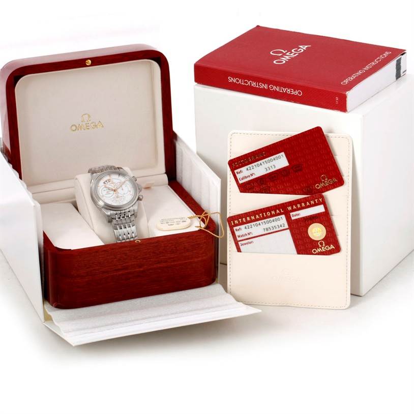 The image shows an Omega De Ville 422.10.41.50.04.001 Men's Stainless Steel White Dial 422.10.41.50.04.001 Men's Stainless Steel White Dial watch in its box, accompanied by an instruction manual and warranty cards.