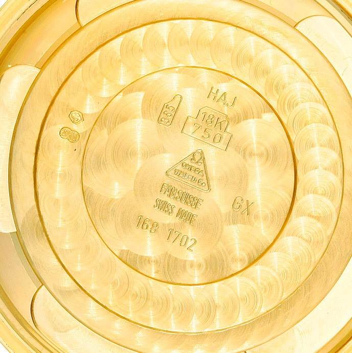 This is the interior of the case back for an Omega De Ville 4633.30.31 Men's Yellow Gold Silver Dial 4633.30.31 Men's Yellow Gold Silver Dial watch, showing hallmark and material inscriptions.