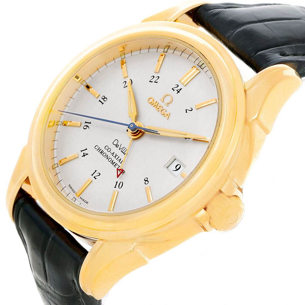 The image shows a frontal close-up of an Omega De Ville 4633.30.31 Men's Yellow Gold Silver Dial 4633.30.31 Men's Yellow Gold Silver Dial watch, highlighting its dial, hands, and gold case with a black leather strap.