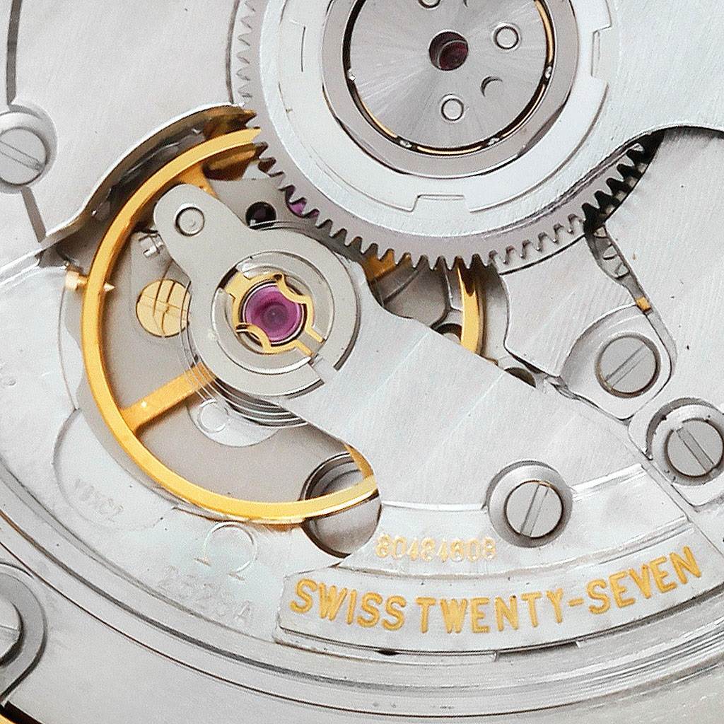 The image shows a close-up view of the internal mechanical movement of an Omega De Ville 4633.30.31 Men's Yellow Gold Silver Dial 4633.30.31 Men's Yellow Gold Silver Dial watch.