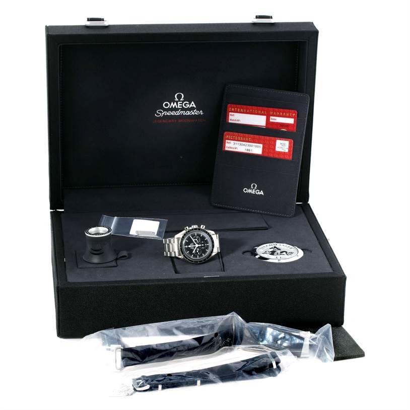The image shows an Omega Speedmaster 311.30.42.30.01.005 Men
s Stainless Steel Black Dial 311.30.42.30.01.005 Men
s Stainless Steel Black Dial watch displayed in its case with additional accessories and documentation.