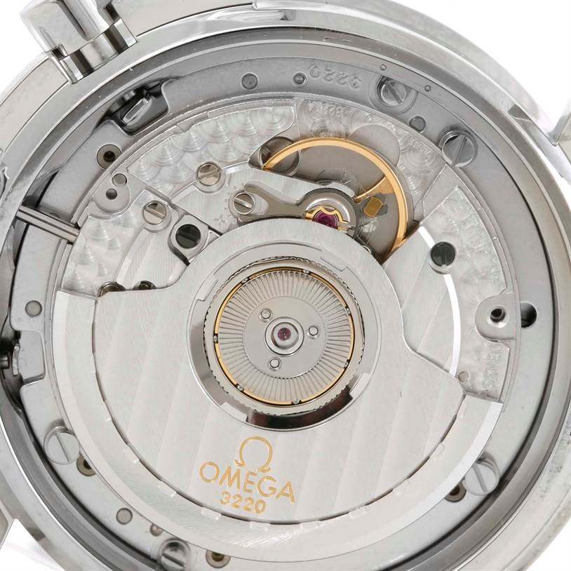 The image shows the interior mechanism of an Omega Speedmaster 3539.50.00 Men
s Stainless Steel Black Dial 3539.50.00 Men
s Stainless Steel Black Dial watch, focused on the movement and rotor.