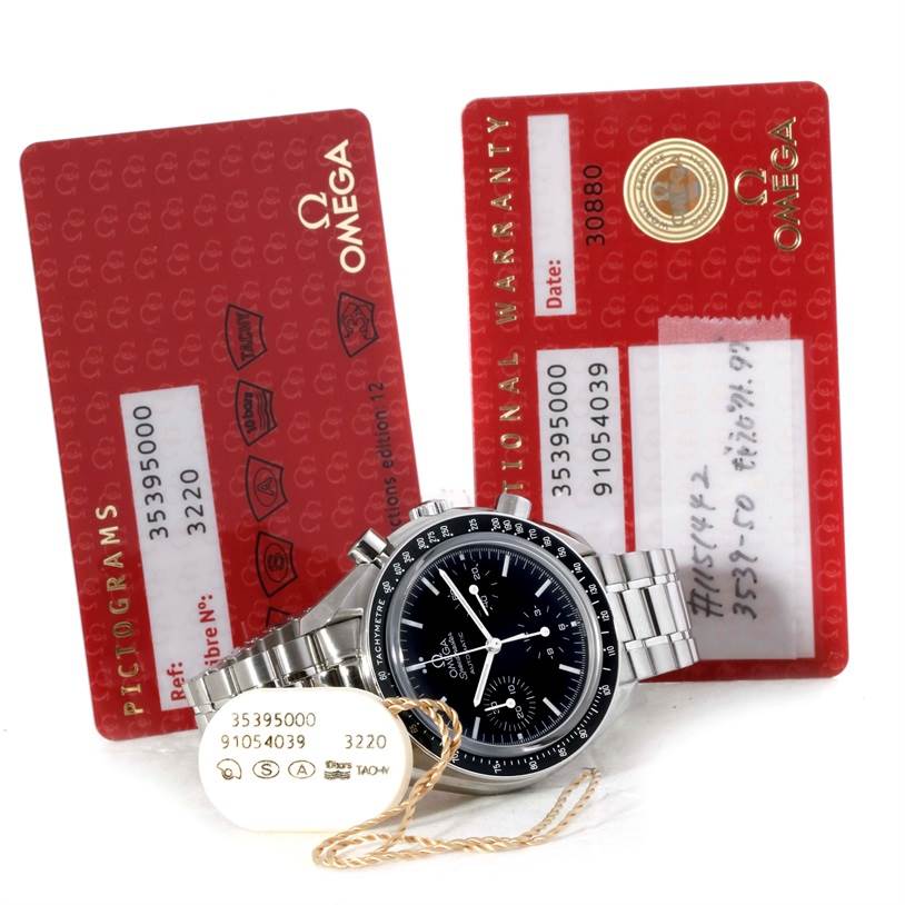 The Omega Speedmaster 3539.50.00 Men
s Stainless Steel Black Dial 3539.50.00 Men
s Stainless Steel Black Dial watch is shown from the front at an angle, alongside identification tags and warranty cards in the background.