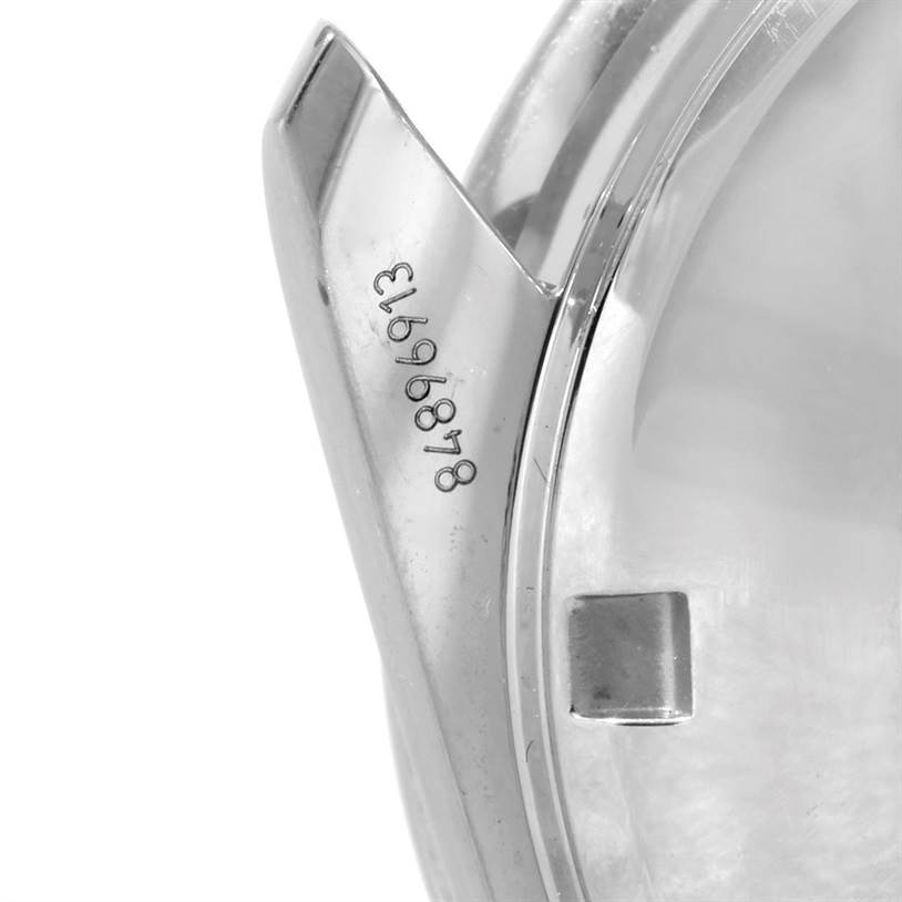 The photo shows a close-up view of the lug area and serial number engraving on an Omega Speedmaster 323.10.40.40.02.001 Men
s Stainless Steel Silver Dial 323.10.40.40.02.001 Men
s Stainless Steel Silver Dial watch.