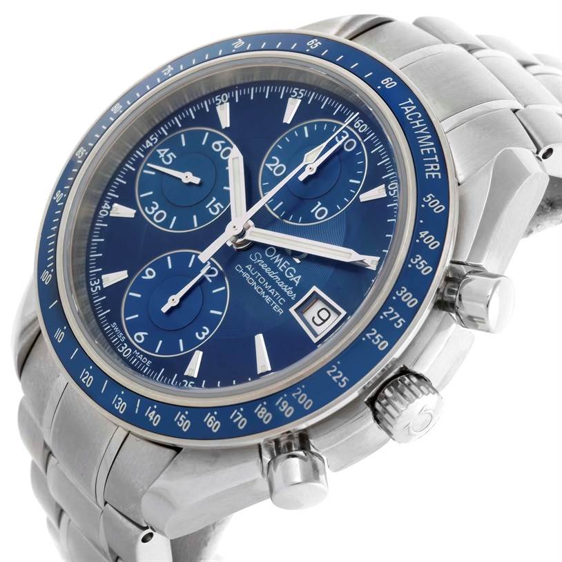 The image shows a close-up of an Omega Speedmaster 3212.80.00 Men
s Stainless Steel Blue Dial 3212.80.00 Men
s Stainless Steel Blue Dial watch, focusing on the blue dial, tachymeter bezel, sub-dials, date window, and crown.