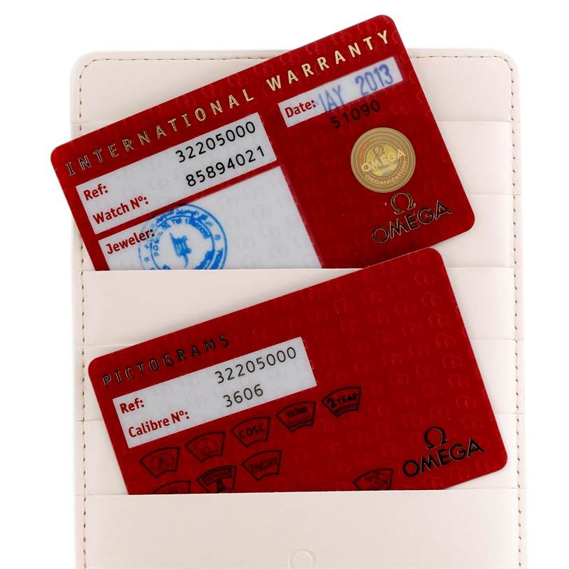 The image shows an International Warranty card and a Pictograms card for an Omega Speedmaster 3220.50.00 Men
s Stainless Steel Black Dial 3220.50.00 Men
s Stainless Steel Black Dial watch.