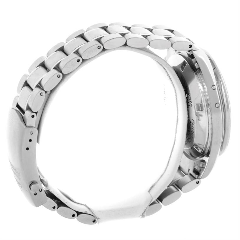 The image shows a side view of the Omega Speedmaster 3575.20.00 Men
s Stainless Steel White Dial 3575.20.00 Men
s Stainless Steel White Dial watch, highlighting its metal bracelet and case back.