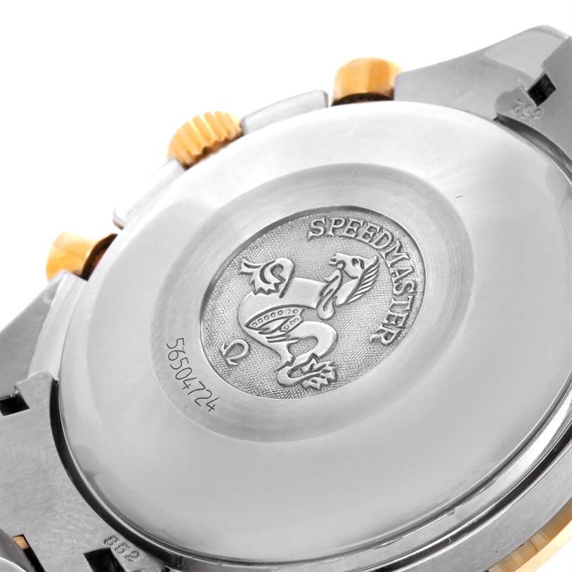 This image shows the back case and crown of an Omega Speedmaster 3313.50.00 Men's Steel and Gold (two tone) Black Dial 3313.50.00 Men's Steel and Gold (two tone) Black Dial watch with the engraved logo and some serial numbers.