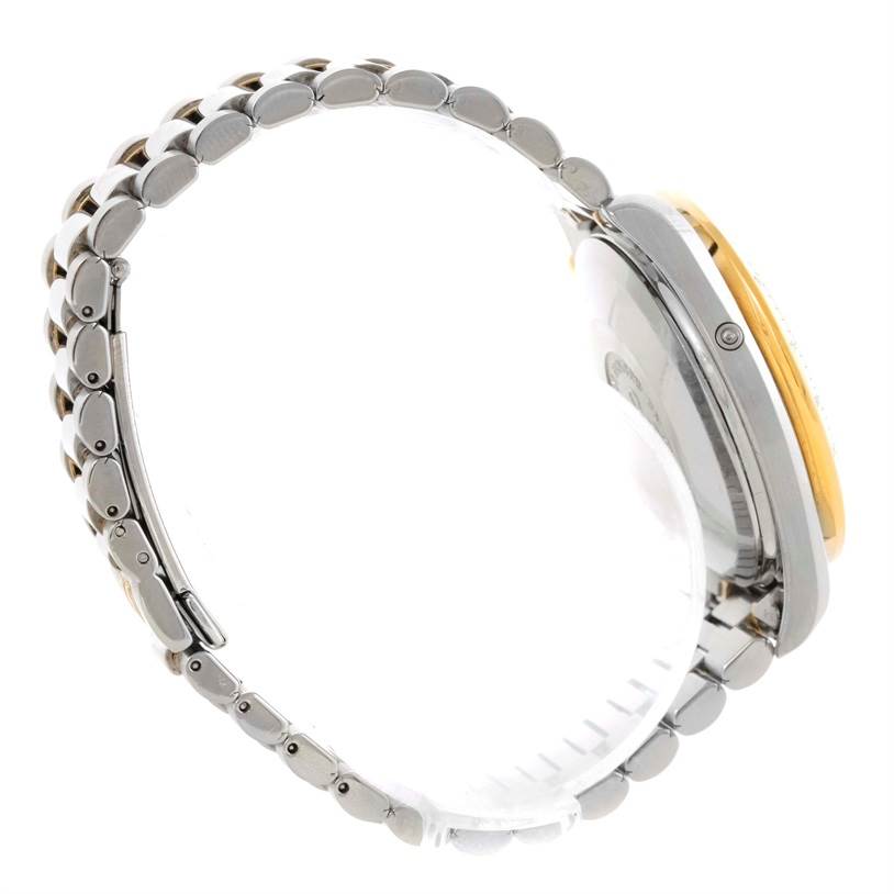 The image shows a side view of the Omega Speedmaster 3330.20.00 Men
s Stainless Steel White Dial 3330.20.00 Men
s Stainless Steel White Dial watch, highlighting its bracelet and part of the case back.