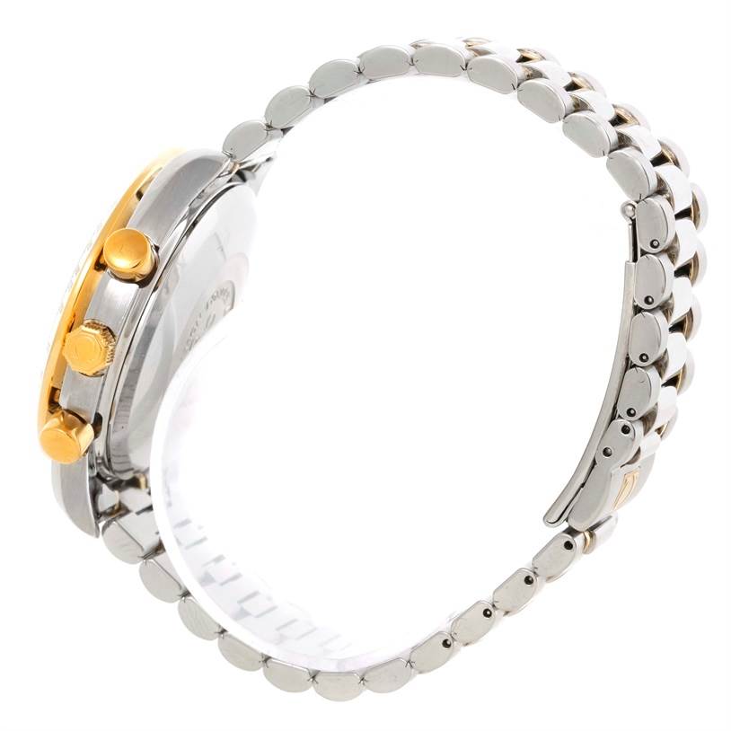 The image shows a side view of the Omega Speedmaster 3330.20.00 Men
s Stainless Steel White Dial 3330.20.00 Men
s Stainless Steel White Dial watch highlighting its bracelet, case, and gold pushers/crown.