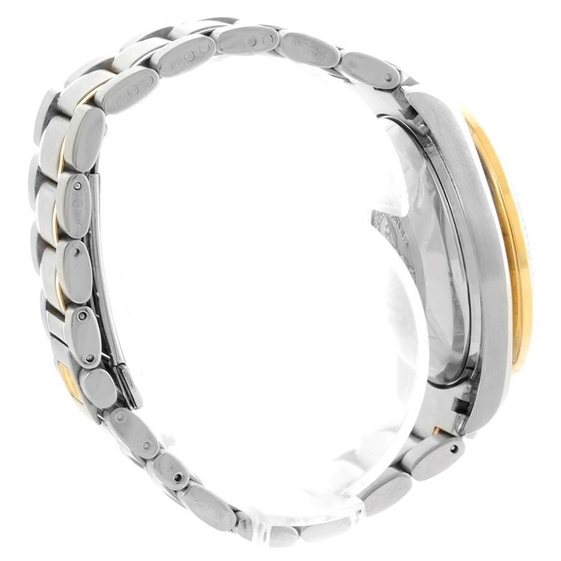 This side angle view of the Omega Speedmaster 3313.33.00 Men's Steel and Gold (two tone) White Dial 3313.33.00 Men's Steel and Gold (two tone) White Dial watch displays its bracelet and case with a partial view of the bezel.