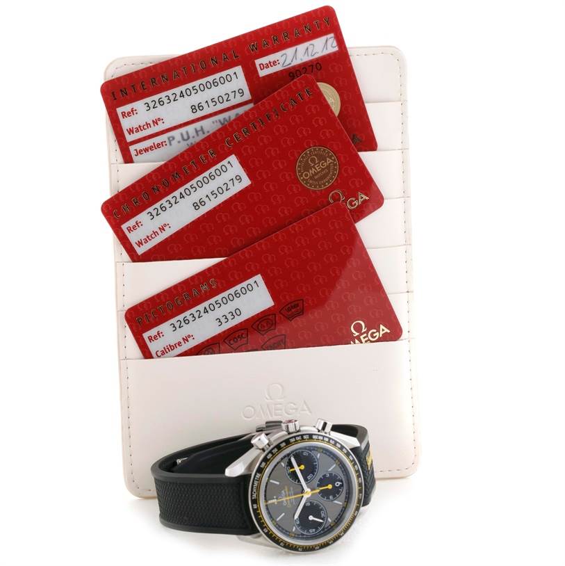 The image shows an Omega Speedmaster 326.32.40.50.06.001 Men
s Stainless Steel Grey Dial 326.32.40.50.06.001 Men
s Stainless Steel Grey Dial watch face at an angle, alongside warranty cards in a holder.