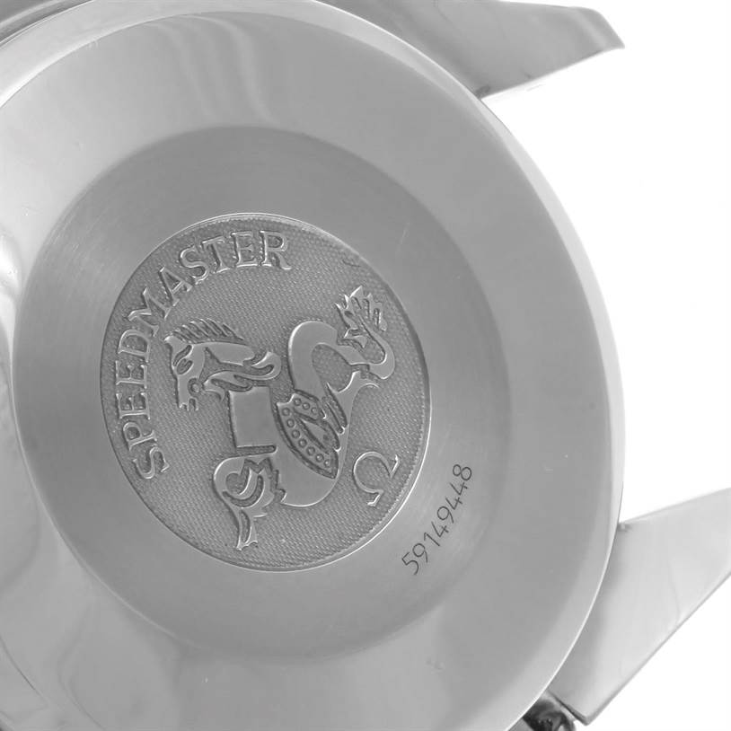 The image shows the back case of an Omega Speedmaster 3523.80.00 Men
s Stainless Steel Blue Dial 3523.80.00 Men
s Stainless Steel Blue Dial watch, featuring its engraved logo and serial number.