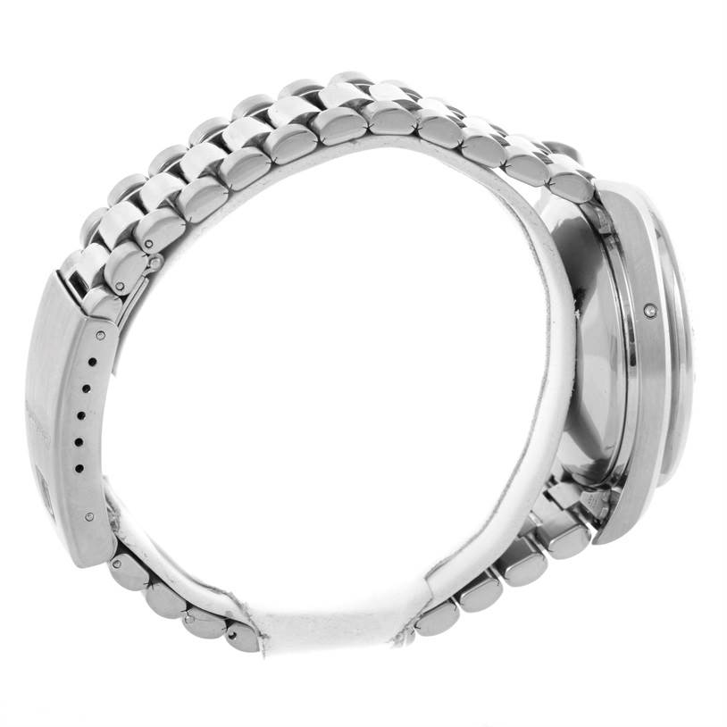 The image shows a side view of an Omega Speedmaster 3523.80.00 Men
s Stainless Steel Blue Dial 3523.80.00 Men
s Stainless Steel Blue Dial watch, highlighting its stainless steel bracelet and clasp.