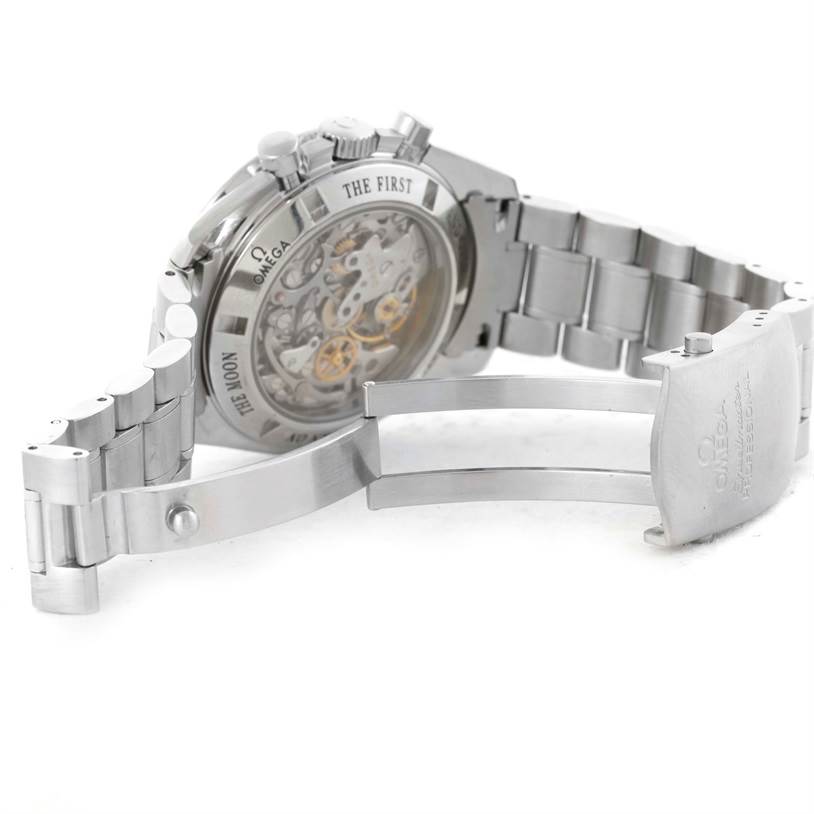 This image shows the case back, movement, and partly open stainless steel bracelet of the Omega Speedmaster 3573.50.00 Men
s Stainless Steel Black Dial 3573.50.00 Men
s Stainless Steel Black Dial watch from an angled rear view.