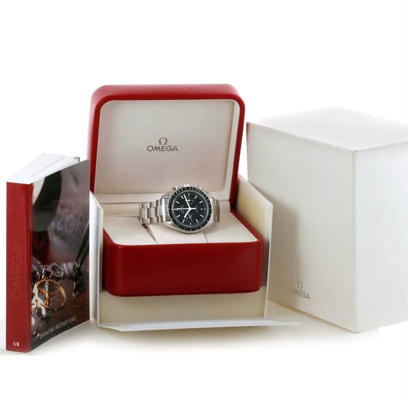The Omega Speedmaster 311.30.44.51.01.002 Stainless Steel Black Dial 311.30.44.51.01.002 Stainless Steel Black Dial watch is displayed in its open box alongside its outer box and instruction manual.