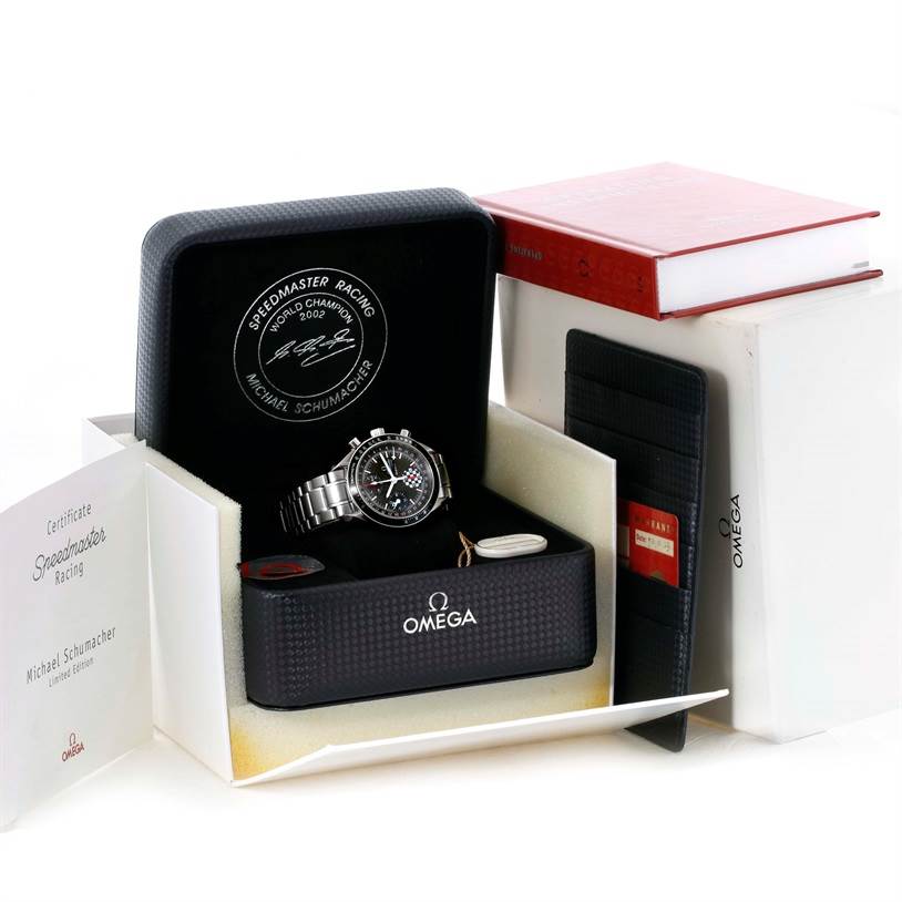 The Omega Speedmaster 3529.50.00 Men
s Stainless Steel Black Dial 3529.50.00 Men
s Stainless Steel Black Dial watch is shown in its opened case with various accessories, certificates, and booklets around it.