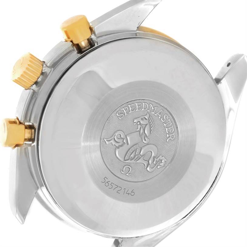 The image shows the back case and two crown buttons of an Omega Speedmaster 3313.50.00 Men's Steel and Gold (two tone) Black Dial 3313.50.00 Men's Steel and Gold (two tone) Black Dial watch.