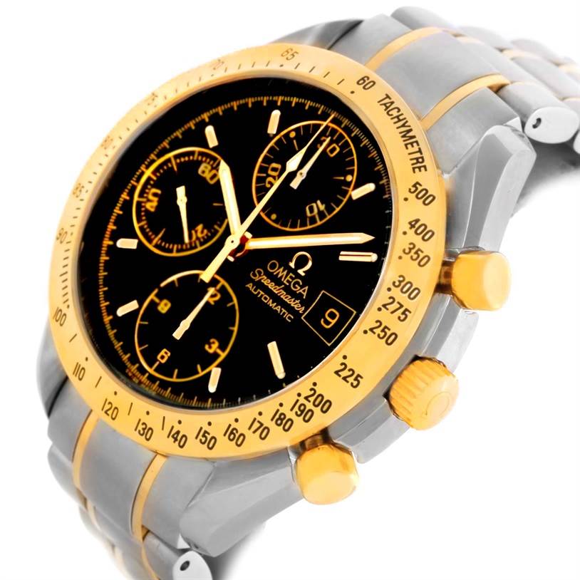 This image shows a close-up of the Omega Speedmaster 3313.50.00 Men's Steel and Gold (two tone) Black Dial 3313.50.00 Men's Steel and Gold (two tone) Black Dial, highlighting its dial, tachymeter, chrono pushers, and part of the bracelet.