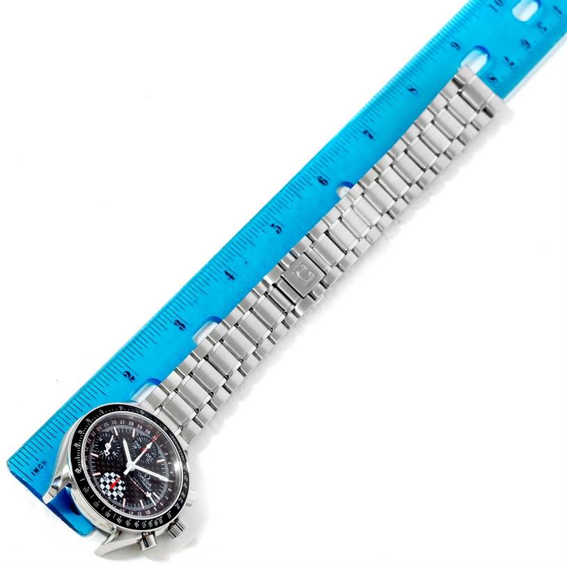 This image shows the Omega Speedmaster 3529.50.00 Men
s Stainless Steel Black Dial 3529.50.00 Men
s Stainless Steel Black Dial watch placed next to a blue ruler, highlighting its stainless steel bracelet and clasp.