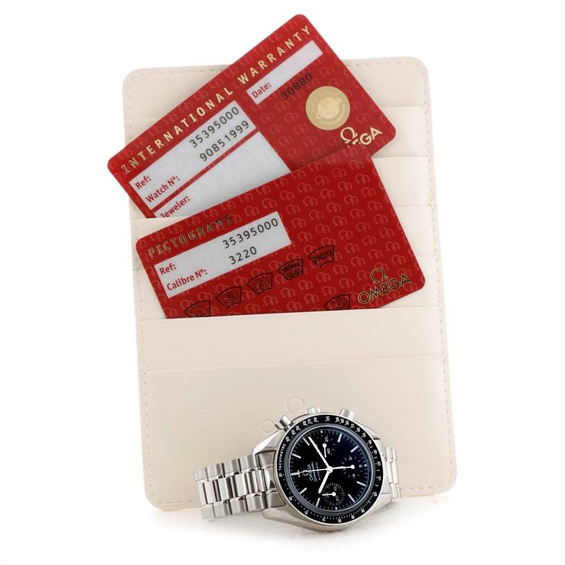 The image shows the Omega Speedmaster 3539.50.00 Men
s Stainless Steel Black Dial 3539.50.00 Men
s Stainless Steel Black Dial watch and international warranty and pictograms cards in a card holder, all viewed from above.