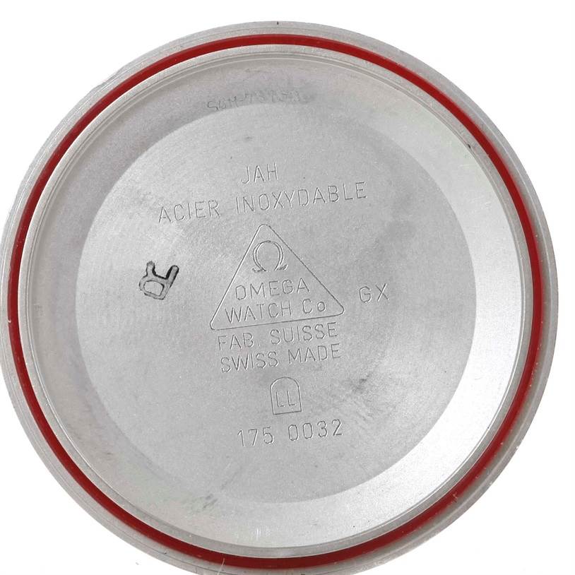 This image shows the inside of the case back of an Omega Speedmaster 3510.50.00 Men
s Stainless Steel Black Dial 3510.50.00 Men
s Stainless Steel Black Dial watch with various engraved details.