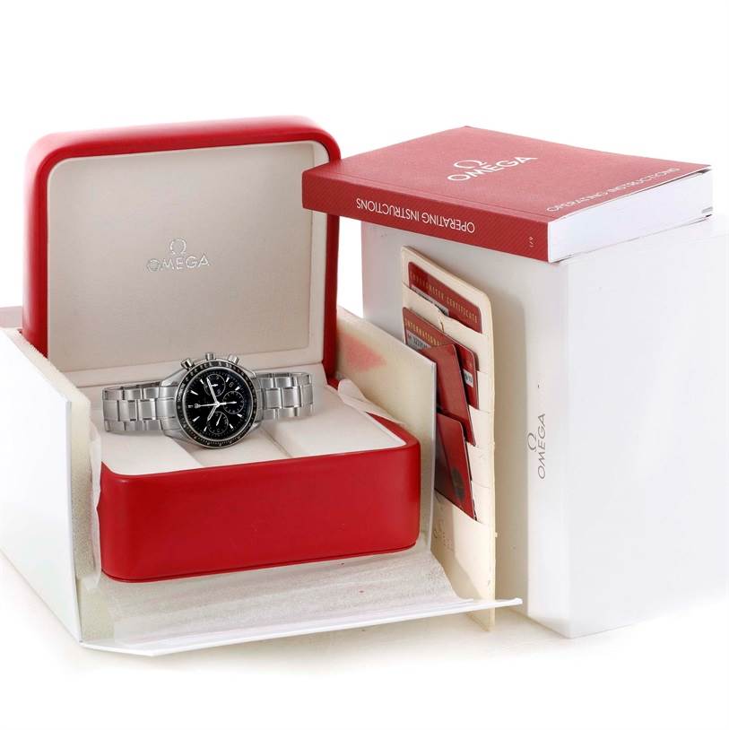 The image shows an Omega Speedmaster 323.30.40.40.01.001 Men
s Stainless Steel Black Dial 323.30.40.40.01.001 Men
s Stainless Steel Black Dial watch placed inside an open red box with accompanying manuals and cards.