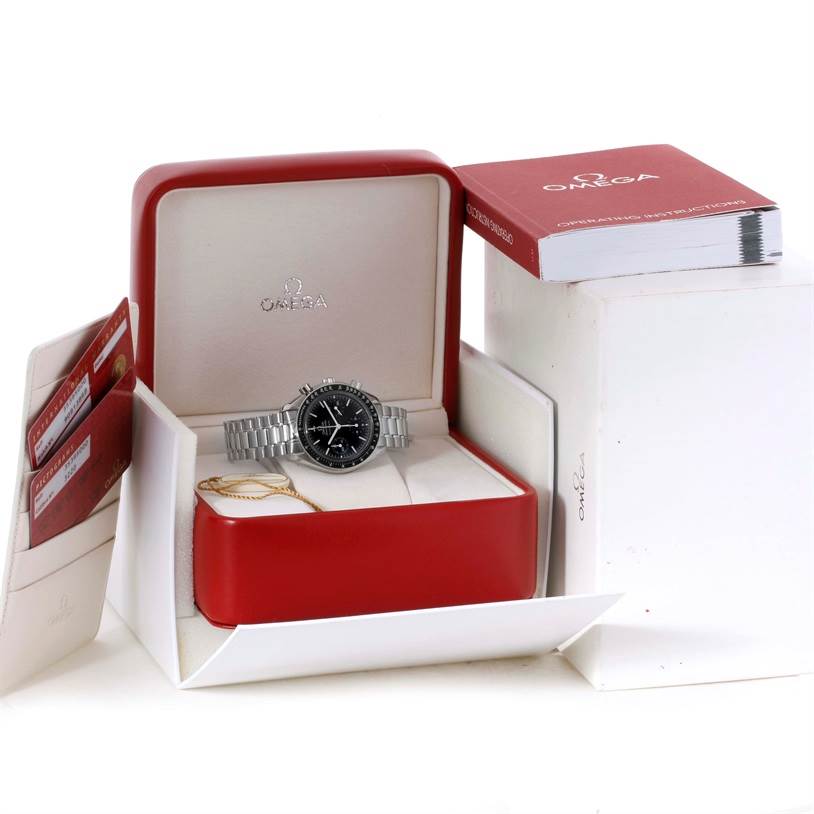 The image shows an Omega Speedmaster 3539.50.00 Men
s Stainless Steel Black Dial 3539.50.00 Men
s Stainless Steel Black Dial watch including its box, warranty cards, manual, and related packaging from a front angle.