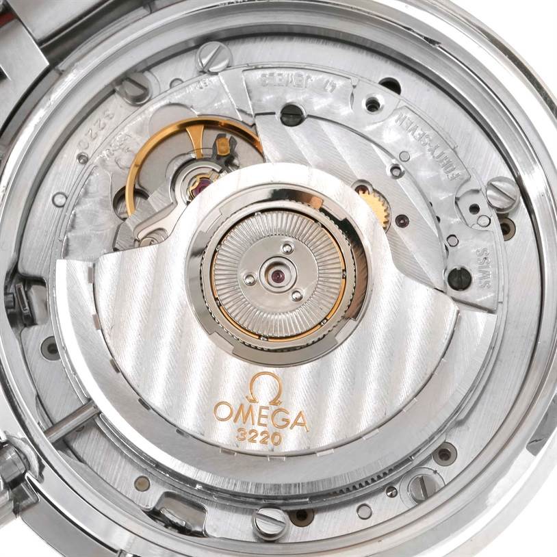 The image shows the back view of the Omega Speedmaster 3539.50.00 Men
s Stainless Steel Black Dial 3539.50.00 Men
s Stainless Steel Black Dial watch, focusing on the exposed mechanical movement and rotor.