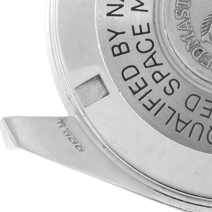 This image shows a close-up of the case back of an Omega Speedmaster 3570.50.00 Men
s Stainless Steel Black Dial 3570.50.00 Men
s Stainless Steel Black Dial watch, featuring part of the engraved text and side of the case.