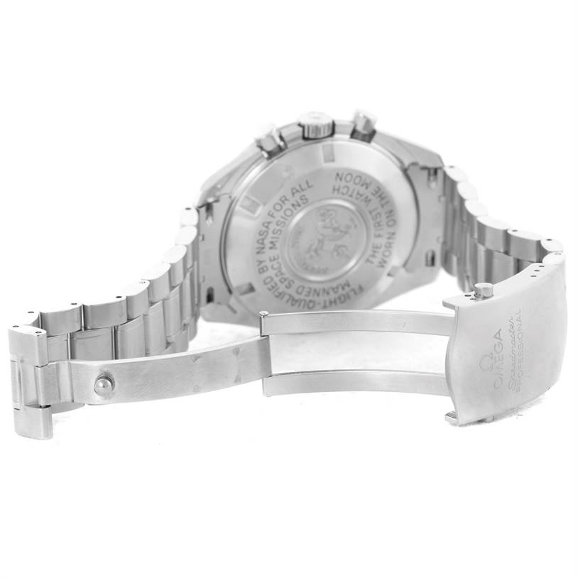 The image shows the backside and open clasp of an Omega Speedmaster 3570.50.00 Men
s Stainless Steel Black Dial 3570.50.00 Men
s Stainless Steel Black Dial watch, displaying its engraved case back and bracelet.