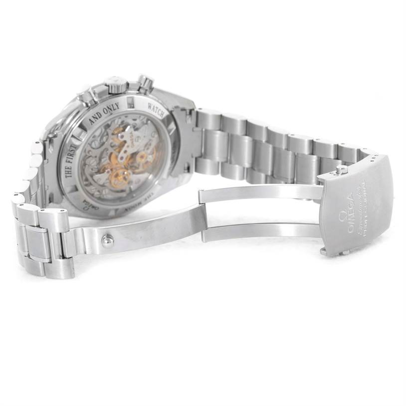 The image shows the back view of an Omega Speedmaster 3573.50.00 Men
s Stainless Steel Black Dial 3573.50.00 Men
s Stainless Steel Black Dial watch, highlighting its open case back and metal bracelet.