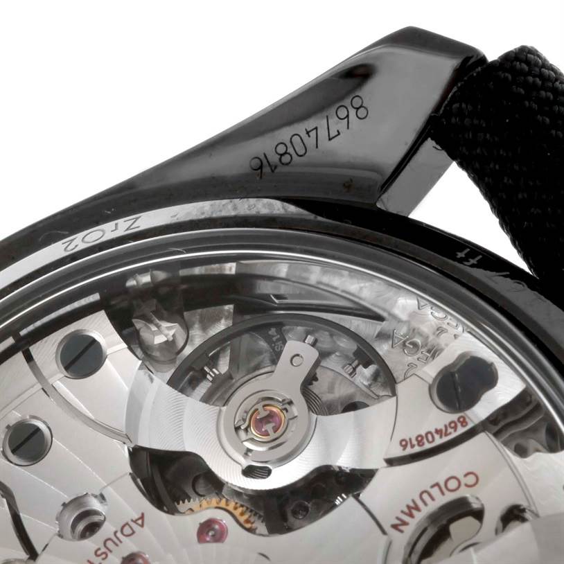 The image shows a close-up of the Omega Speedmaster 311.92.44.51.01.003 Men's Stainless Steel Black Dial 311.92.44.51.01.003 Men's Stainless Steel Black Dial's transparent case back, revealing its intricate movement mechanism.