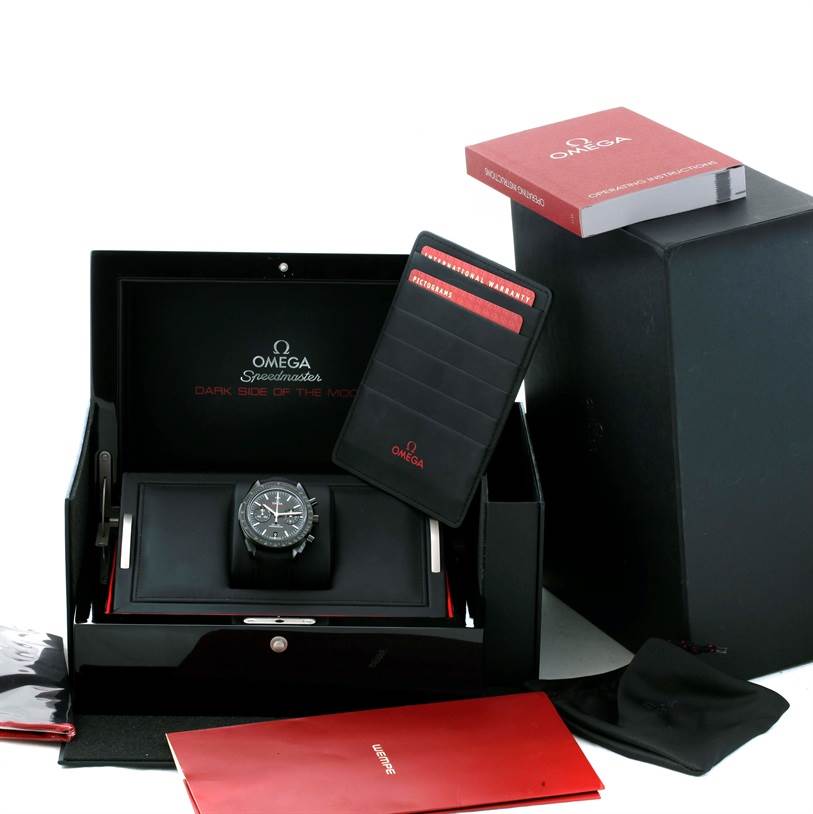 The image shows an Omega Speedmaster 311.92.44.51.01.003 Men's Stainless Steel Black Dial 311.92.44.51.01.003 Men's Stainless Steel Black Dial watch presented inside its box, along with the warranty card, manuals, and other accessories.