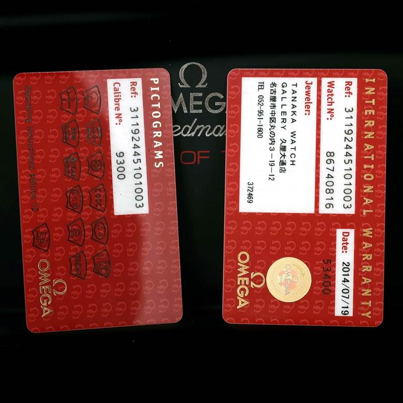 The image shows pictograms and an international warranty card for the Omega Speedmaster 311.92.44.51.01.003 Men's Stainless Steel Black Dial 311.92.44.51.01.003 Men's Stainless Steel Black Dial watch.