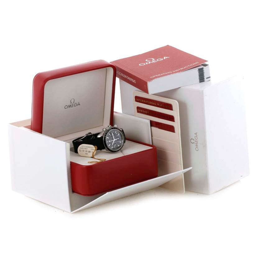 The image shows an Omega Speedmaster 323.32.40.40.06.001 Men
s Stainless Steel Grey Dial 323.32.40.40.06.001 Men
s Stainless Steel Grey Dial watch in its box, along with manuals and warranty cards.