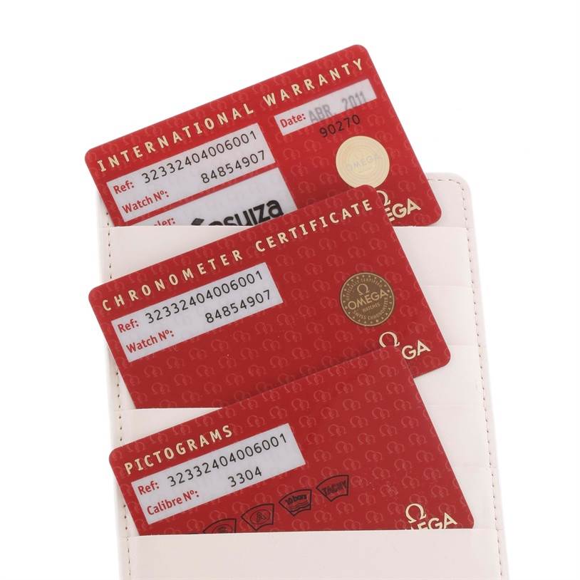 This image shows the International Warranty, Chronometer Certificate, and Pictograms cards for the Omega Speedmaster 323.32.40.40.06.001 Men
s Stainless Steel Grey Dial 323.32.40.40.06.001 Men
s Stainless Steel Grey Dial model.