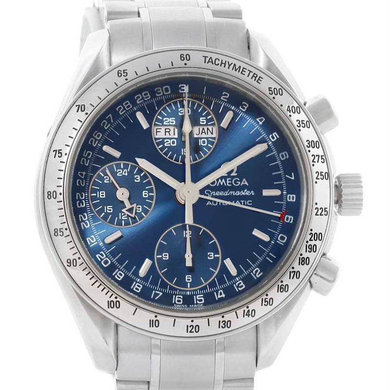 The image shows a front view of the Omega Speedmaster watch, highlighting the blue dial, chronograph sub-dials, and tachymeter bezel.