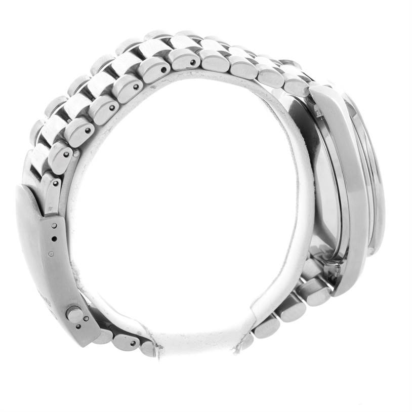 The image shows a side view of the Omega Speedmaster 3510.50.00 Men
s Stainless Steel Black Dial 3510.50.00 Men
s Stainless Steel Black Dial watch, focusing on its stainless steel bracelet and clasp.