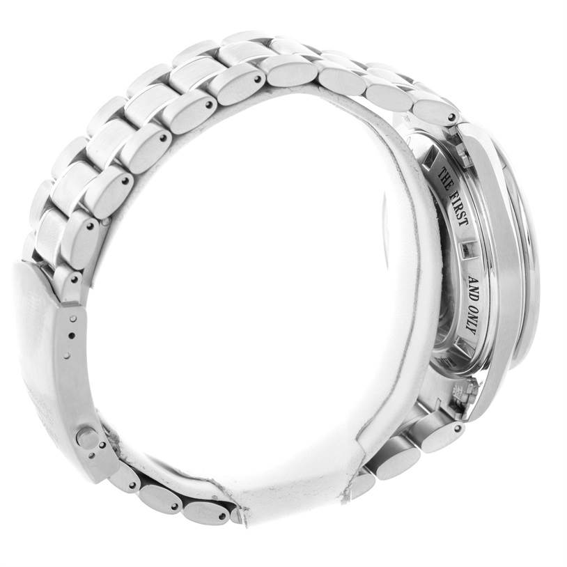 The image shows a side view of an Omega Speedmaster 3573.50.00 Men
s Stainless Steel Black Dial 3573.50.00 Men
s Stainless Steel Black Dial watch featuring its metal bracelet and partially visible case back inscription.