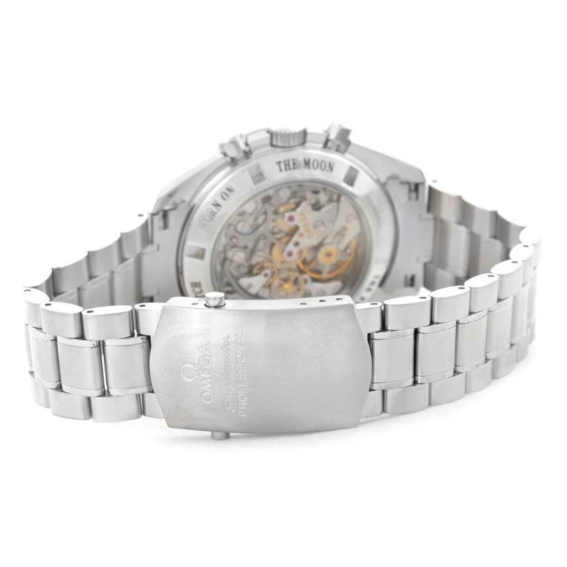 The image shows the back view of an Omega Speedmaster 3573.50.00 Men
s Stainless Steel Black Dial 3573.50.00 Men
s Stainless Steel Black Dial, highlighting the transparent case back and metal bracelet.