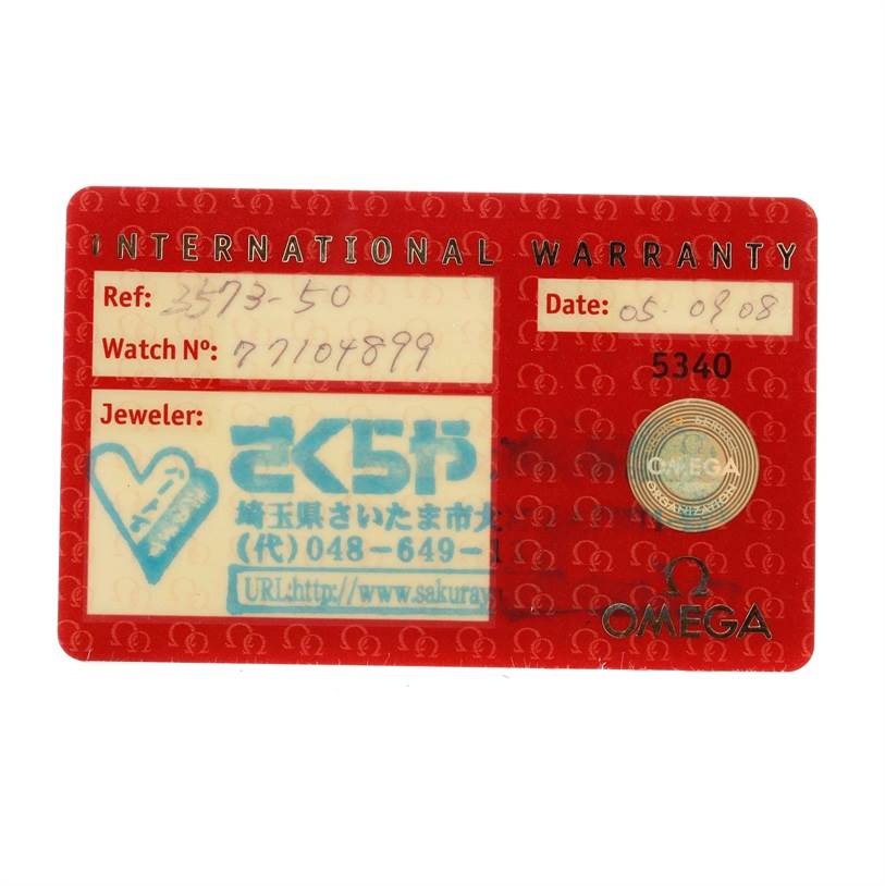 This image shows an Omega Speedmaster 3573.50.00 Men
s Stainless Steel Black Dial 3573.50.00 Men
s Stainless Steel Black Dial International Warranty card from a top-down angle.